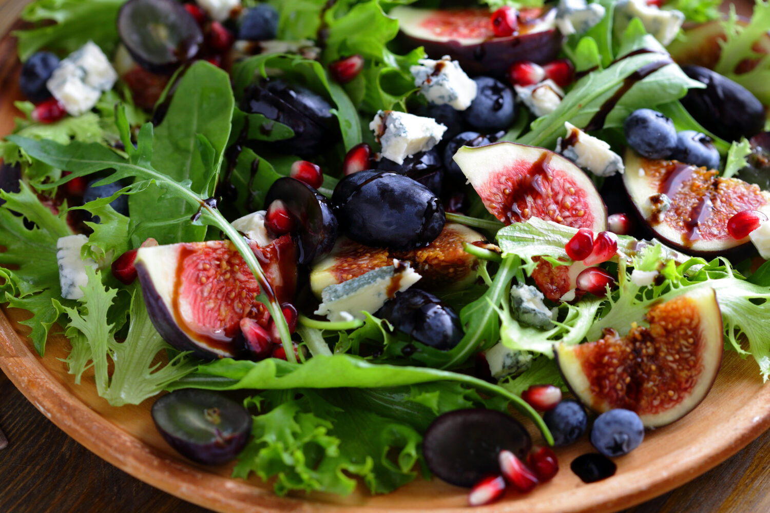salad with figs and cheese on plate